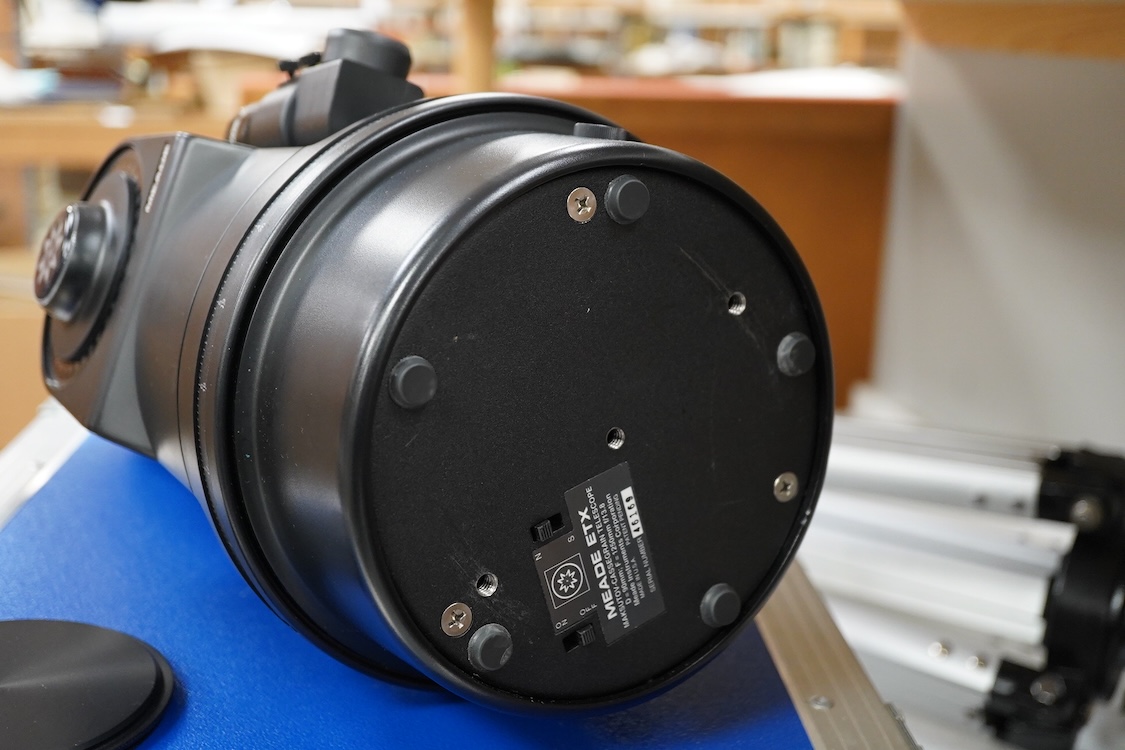 A cased Meade ETX Astro telescope, with instruction manual contained within the original flight case, 46 x 36 x 23cm, together with an additional Orion glass solar filter and tripod